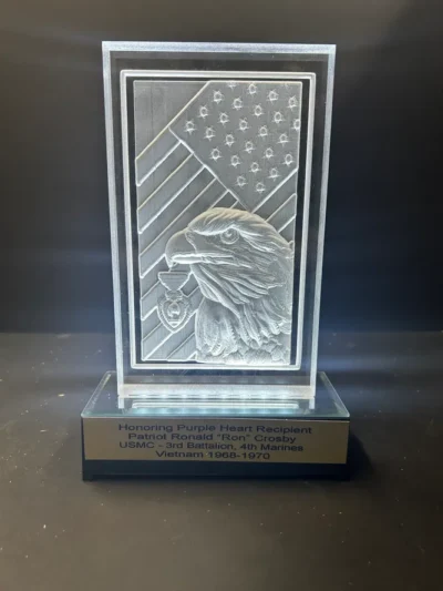 Engraved plaque honoring Purple Heart recipient.